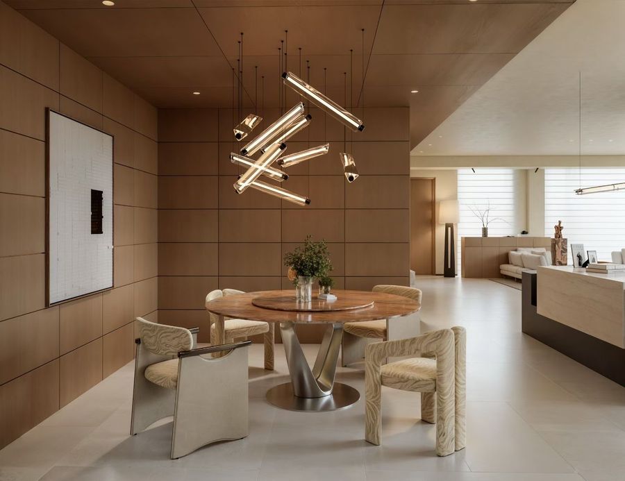 Dining area with timber-panelled walls